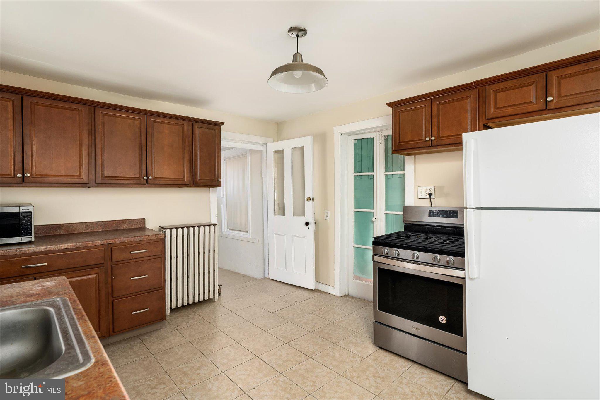 75 Patton Avenue, Unit 1 Princeton, NJ 08540 - Photo 9 of 20 a kitchen with stainless steel appliances a stove a refrigerator and a sink