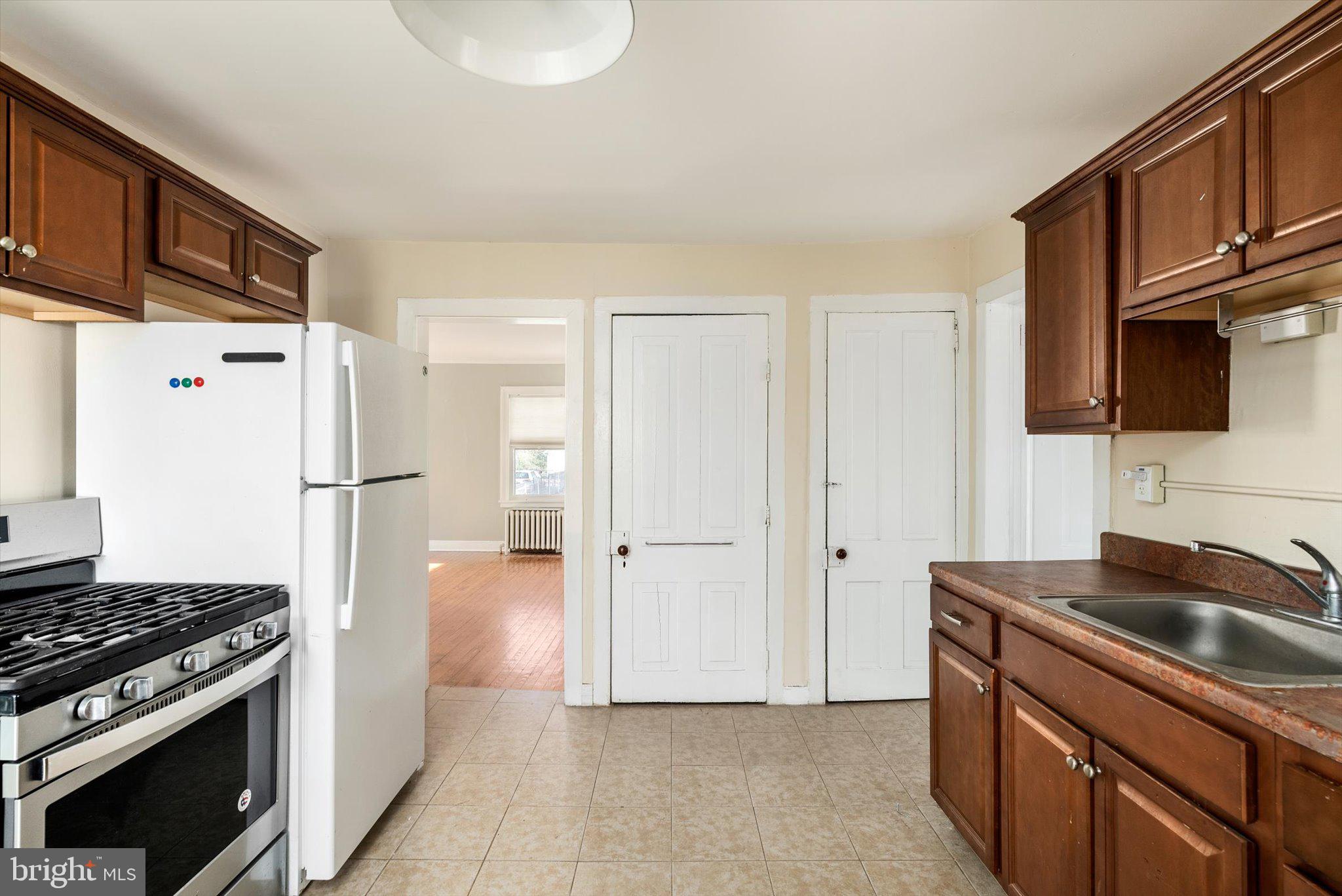 75 Patton Avenue, Unit 1 Princeton, NJ 08540 - Photo 10 of 20 a kitchen with stainless steel appliances granite countertop a refrigerator and a sink