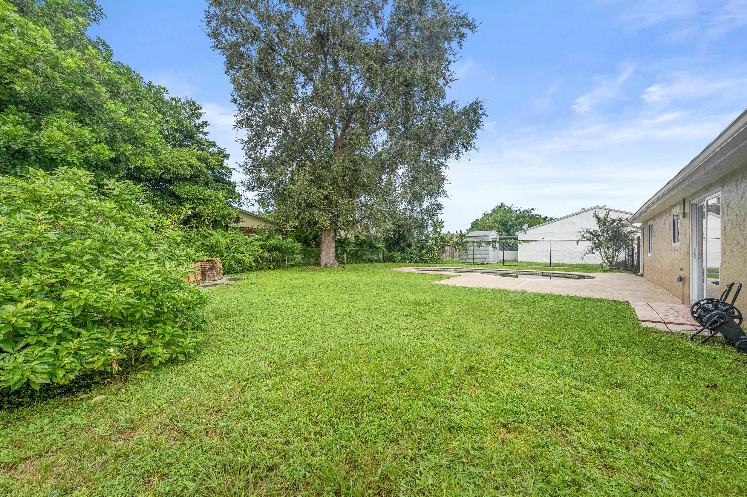 1357 Ryan Lane Royal Palm Beach, FL 33411 - Photo 17 of 23 a view of garden with trees