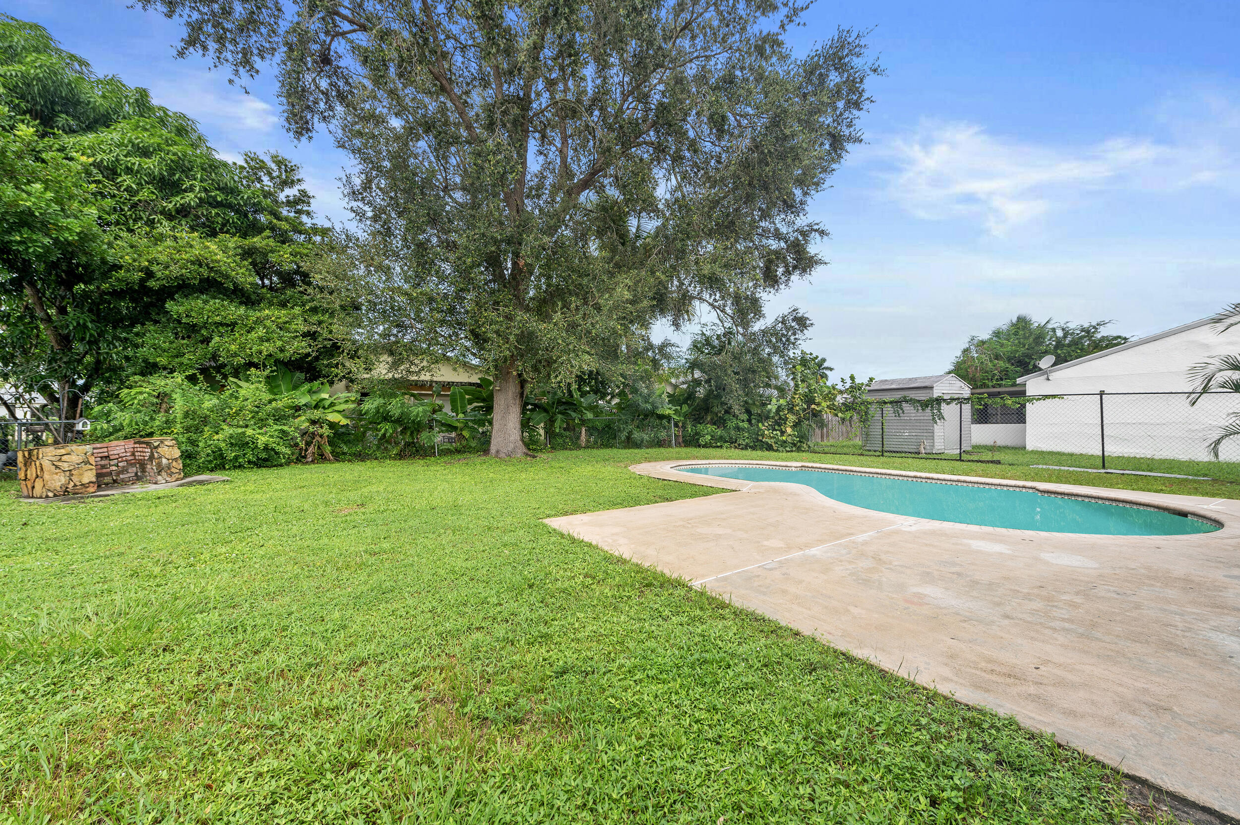 1357 Ryan Lane Royal Palm Beach, FL 33411 - Photo 18 of 23 a view of a golf course