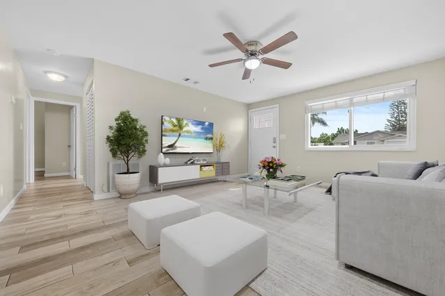 a living room with furniture and a large window