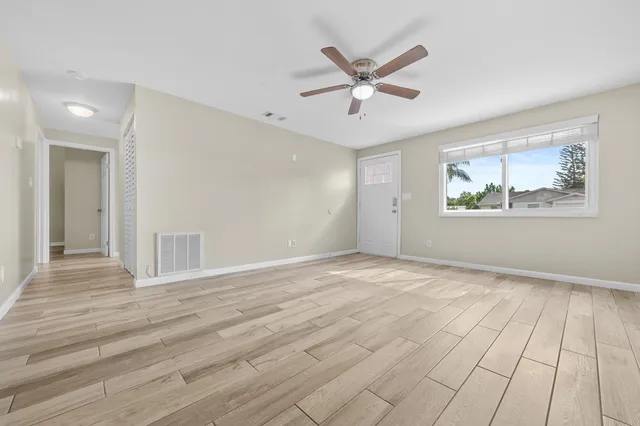 a view of an empty room and window