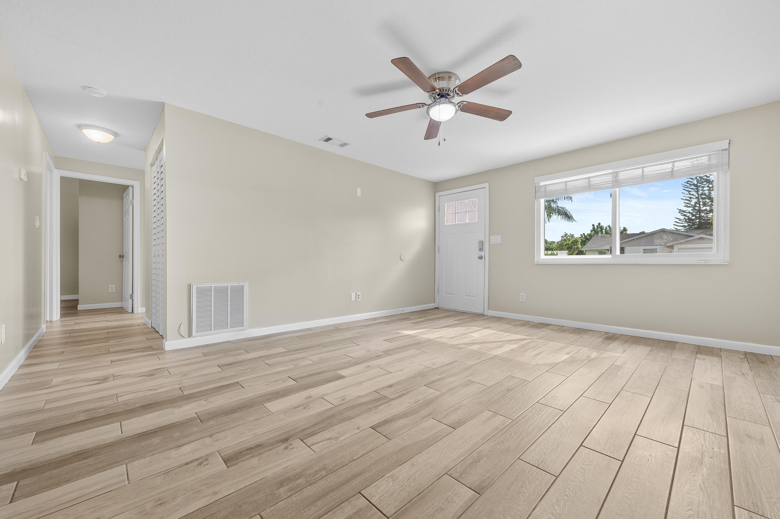 1357 Ryan Lane Royal Palm Beach, FL 33411 - Photo 6 of 23 a view of an empty room and window