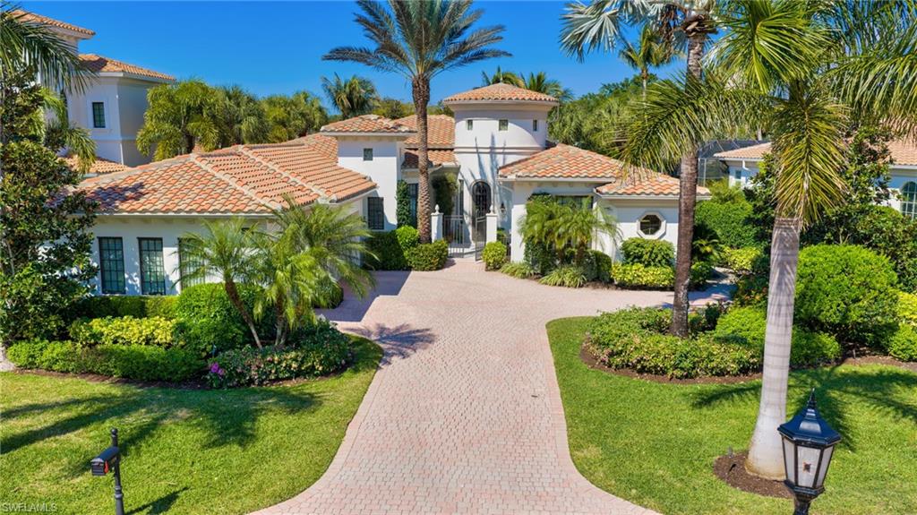 1705 Venezia Way Naples, FL 34105 - Photo 1 of 50 Welcome to 1705 Venezia Way....an interior neighborhood within Grey Oaks Country Club.