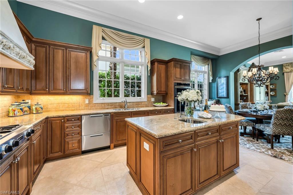 1705 Venezia Way Naples, FL 34105 - Photo 17 of 50 Lot's of windows to let in that Florida sun! Gas 6-burner range with griddle, Fisher & Paykel dishwasher drawers and plenty of space for the chef!
