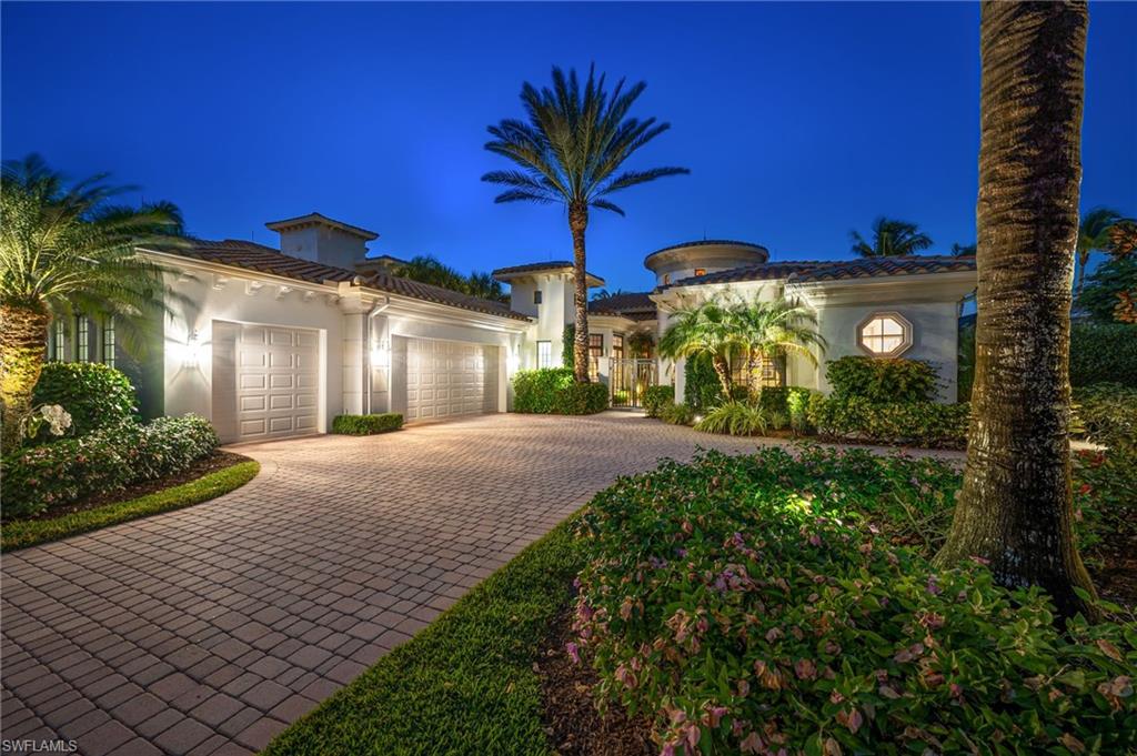 1705 Venezia Way Naples, FL 34105 - Photo 37 of 50 This residence comes to life in the evening, with added landscape lighting around the residence.