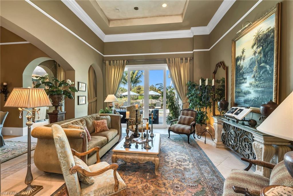 1705 Venezia Way Naples, FL 34105 - Photo 8 of 50 This was a model home and has incredible ceiling heights, with the living and dining room at 16 feet.
