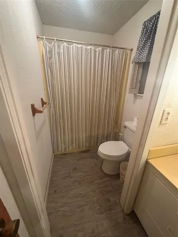 a view of a hallway with washer and dryer
