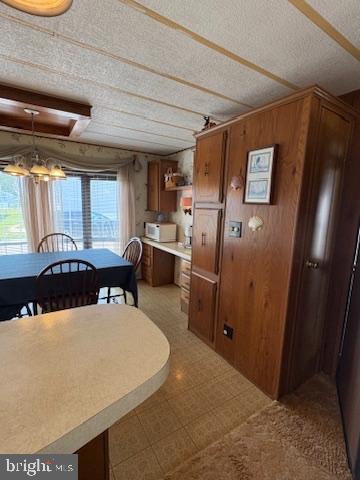 38354 Squirrel Road, Unit 19312 Ocean View, DE 19970 - Photo 15 of 39 a living room with stainless steel appliances kitchen island granite countertop furniture and a refrigerator
