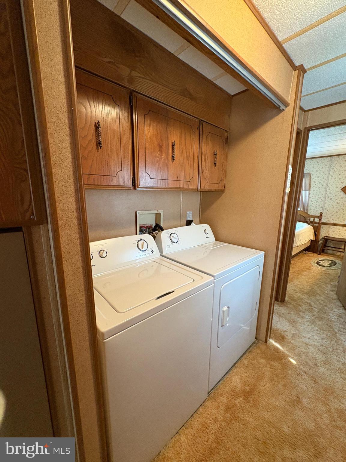 38354 Squirrel Road, Unit 19312 Ocean View, DE 19970 - Photo 29 of 39 a utility room with dryer and washer
