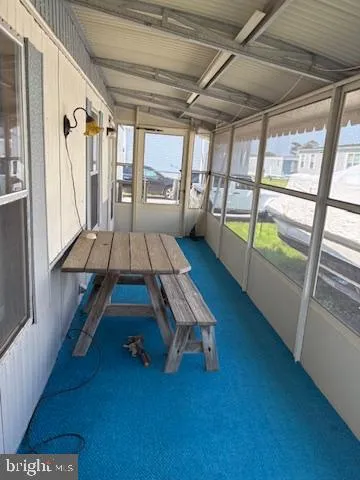 a room with wooden floors and furniture