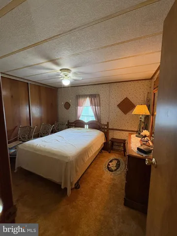 a bedroom with a bed and a table