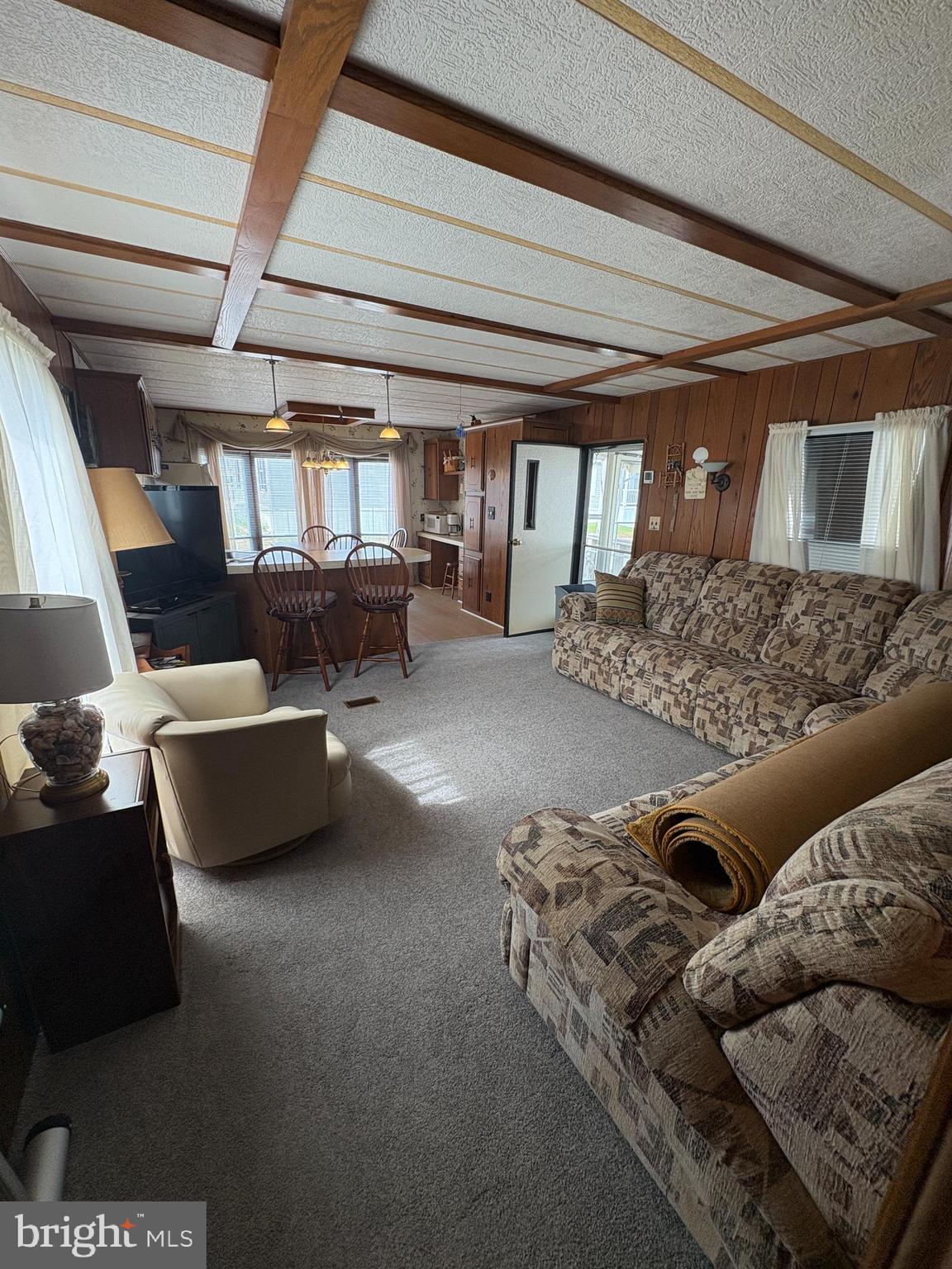38354 Squirrel Road, Unit 19312 Ocean View, DE 19970 - Photo 8 of 39 a living room with furniture and a window