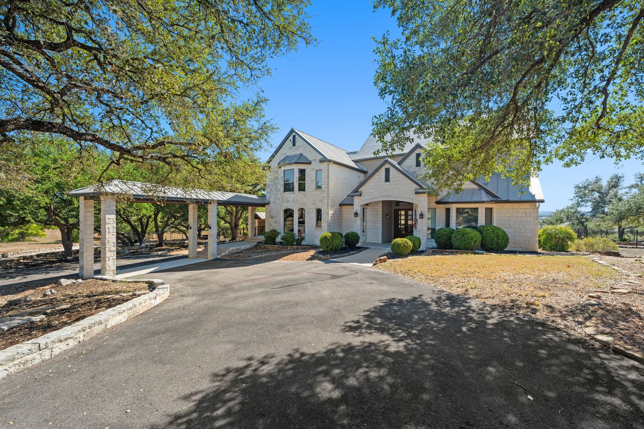 185 Shimmering Shore Court Spring Branch, TX 78070 - Photo 6 of 36 French country home with asphalt driveway