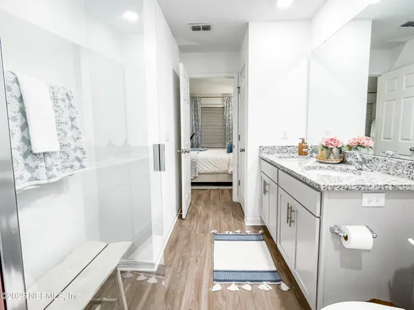 a bathroom with a sink a mirror and a vanity