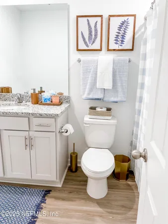 a bathroom with a toilet and a sink