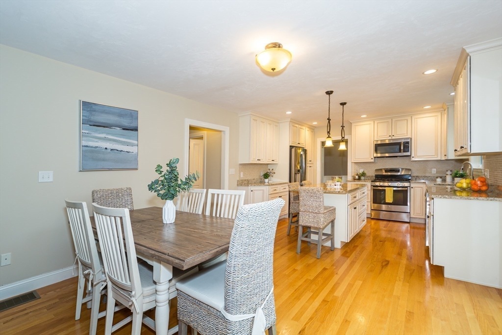 9 Flynn Street Natick, MA 01760 - Photo 13 of 36 a view of a dining room with furniture and wooden floor