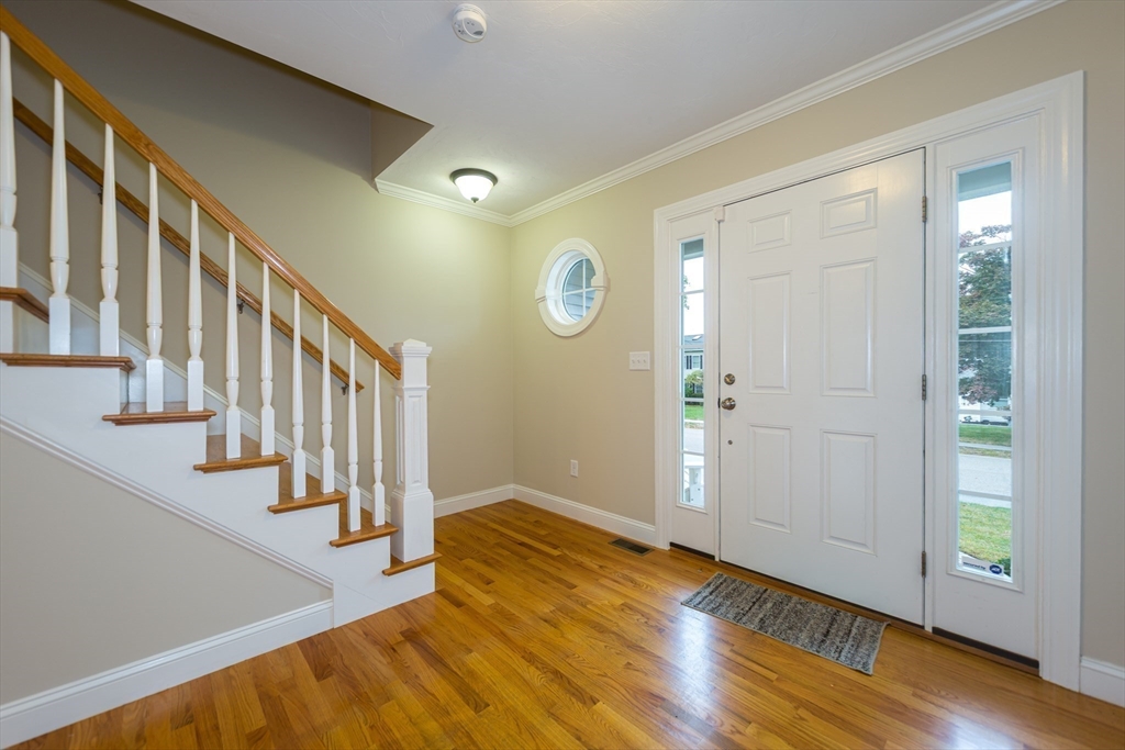 9 Flynn Street Natick, MA 01760 - Photo 17 of 36 a view of an entryway with wooden floor