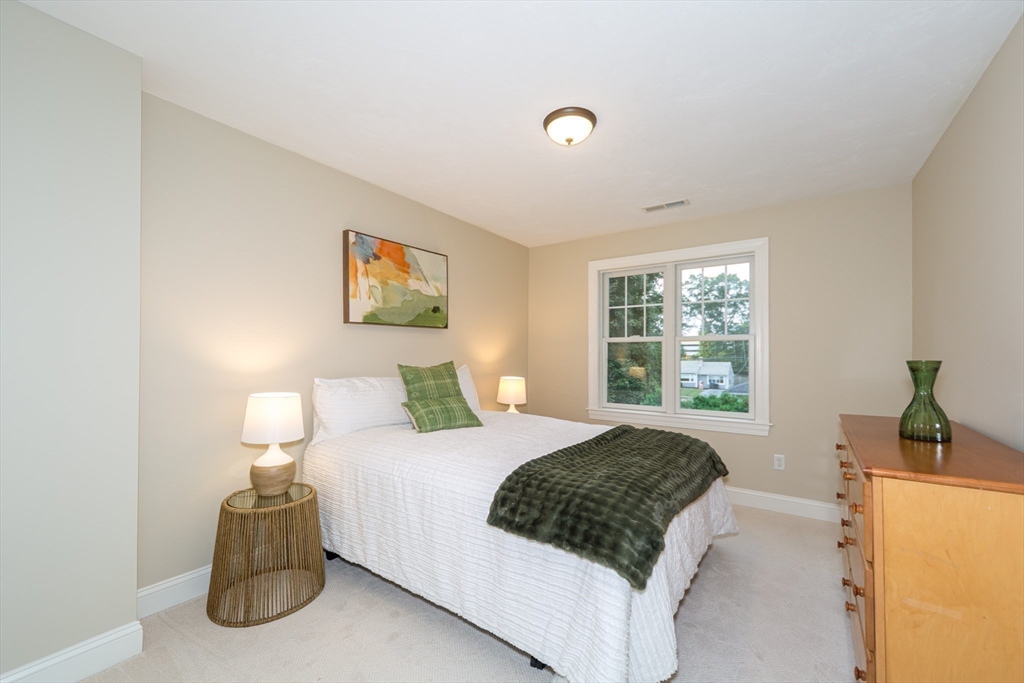 9 Flynn Street Natick, MA 01760 - Photo 24 of 36 a bedroom with a bed and window
