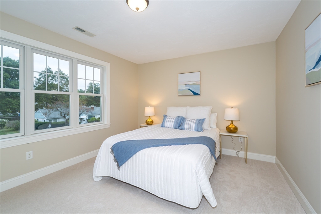 9 Flynn Street Natick, MA 01760 - Photo 26 of 36 a bedroom with a bed and a window