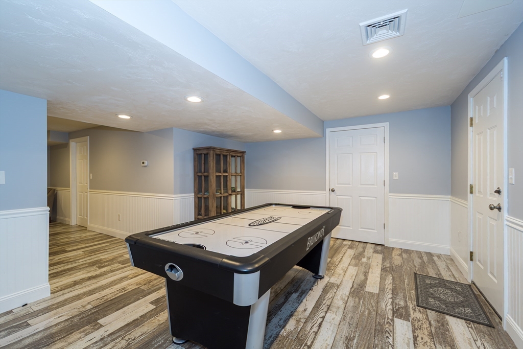 9 Flynn Street Natick, MA 01760 - Photo 28 of 36 a room with a table and chairs