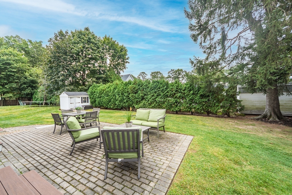 9 Flynn Street Natick, MA 01760 - Photo 34 of 36 a view of a backyard with sitting area