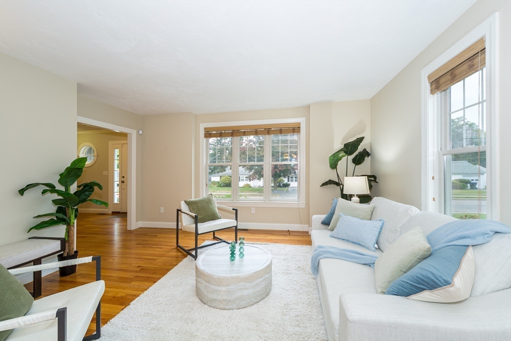 9 Flynn Street Natick, MA 01760 - Photo 6 of 36 a living room with furniture and a large window