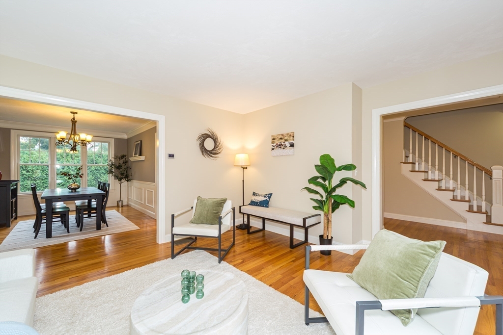 9 Flynn Street Natick, MA 01760 - Photo 7 of 36 a living room with furniture potted plant and a large window