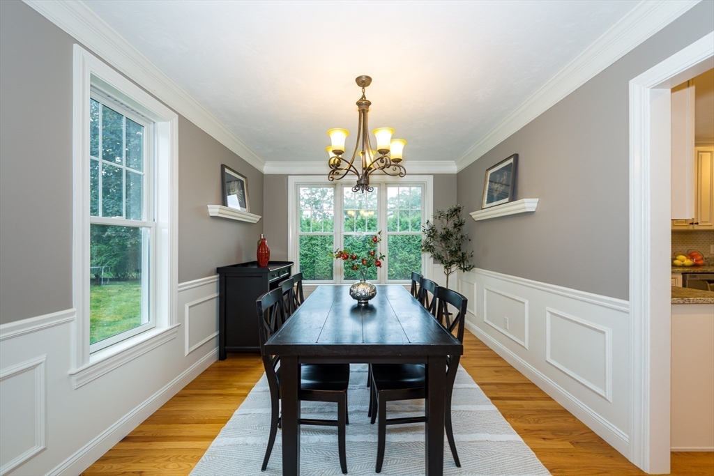 9 Flynn Street Natick, MA 01760 - Photo 8 of 36 a view of a dining room with furniture window and wooden floor