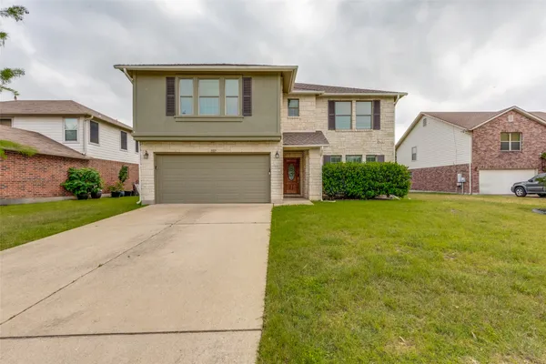 front view of a house with a yard