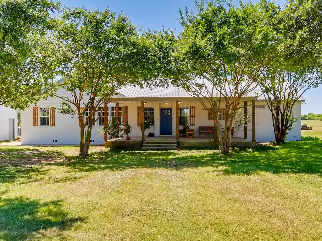 984 Red Town Road Elgin, TX 78621 - Photo 1 of 1 a view of a house with a yard