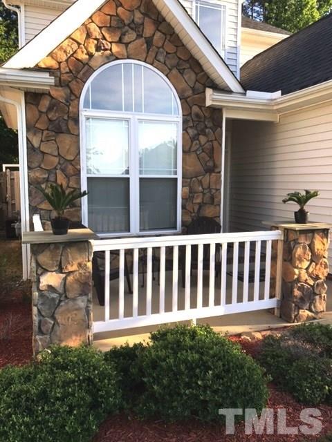 3136 La Costa Way Raleigh, NC 27610 - Photo 2 of 21 a view of a house with a small yard and wooden fence