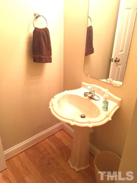 3136 La Costa Way Raleigh, NC 27610 - Photo 13 of 21 a bathroom with a sink and a mirror