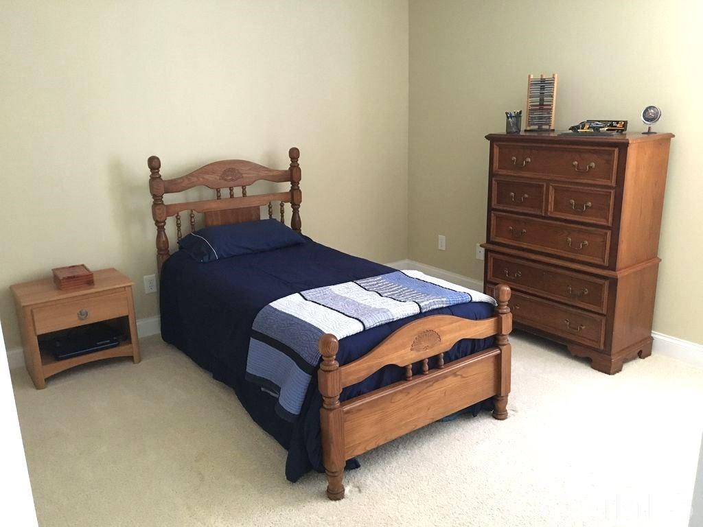 3136 La Costa Way Raleigh, NC 27610 - Photo 17 of 21 a bedroom with a bed and dresser