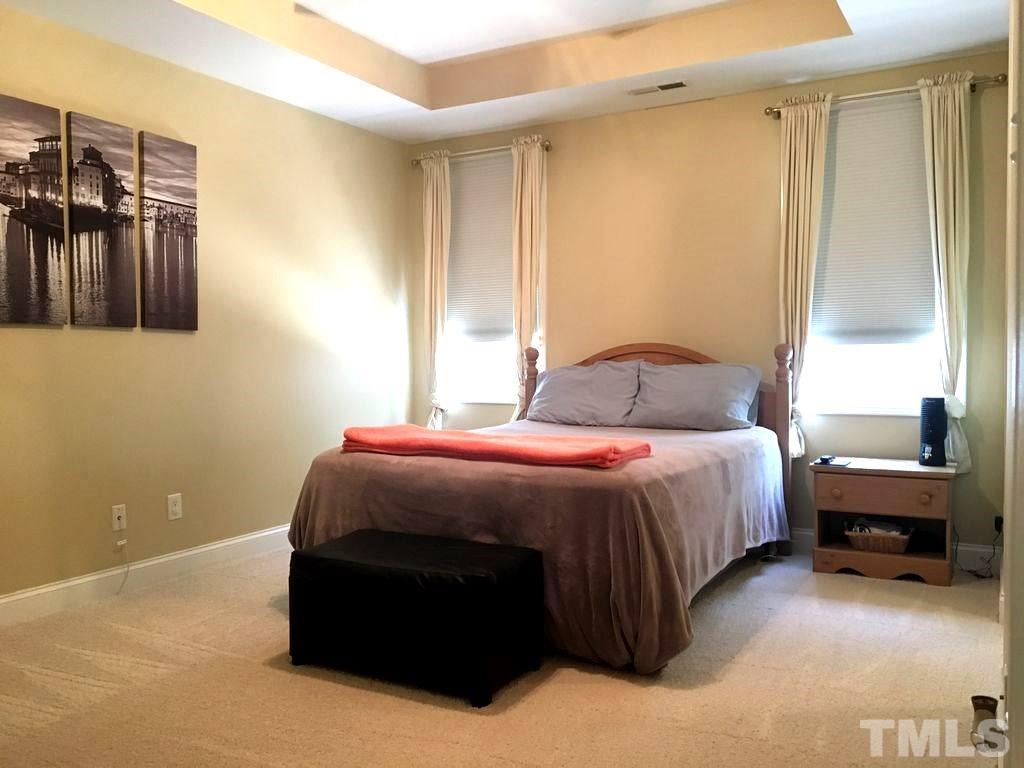 3136 La Costa Way Raleigh, NC 27610 - Photo 9 of 21 a bedroom with a bed and a window