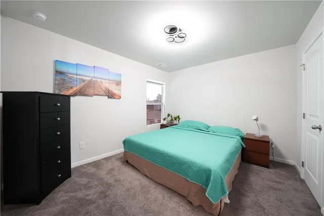 a bedroom with a bed and a closet