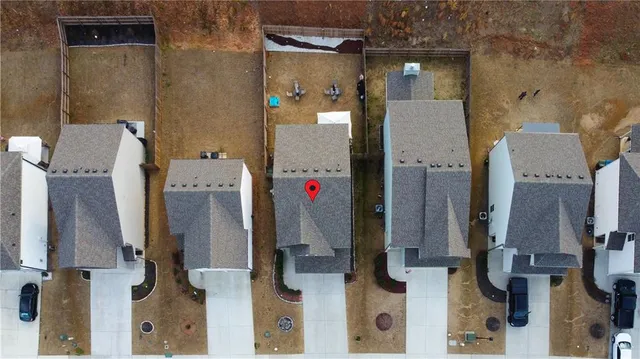 an aerial view of residential houses with stairs