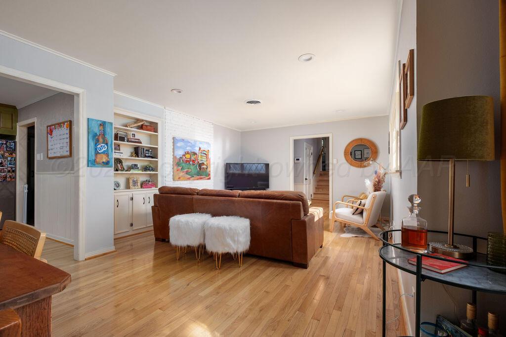 4314 Emil Avenue Amarillo, TX 79106 - Photo 12 of 44 a living room with furniture and a flat screen tv