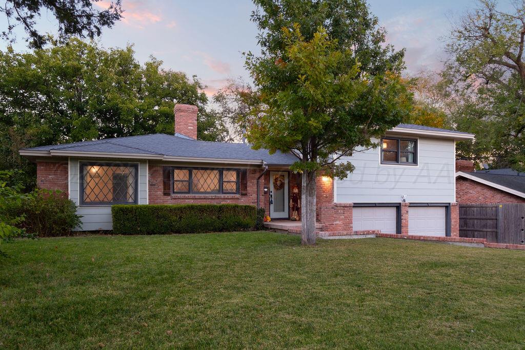 4314 Emil Avenue Amarillo, TX 79106 - Photo 2 of 44 a front view of a house with a yard and trees