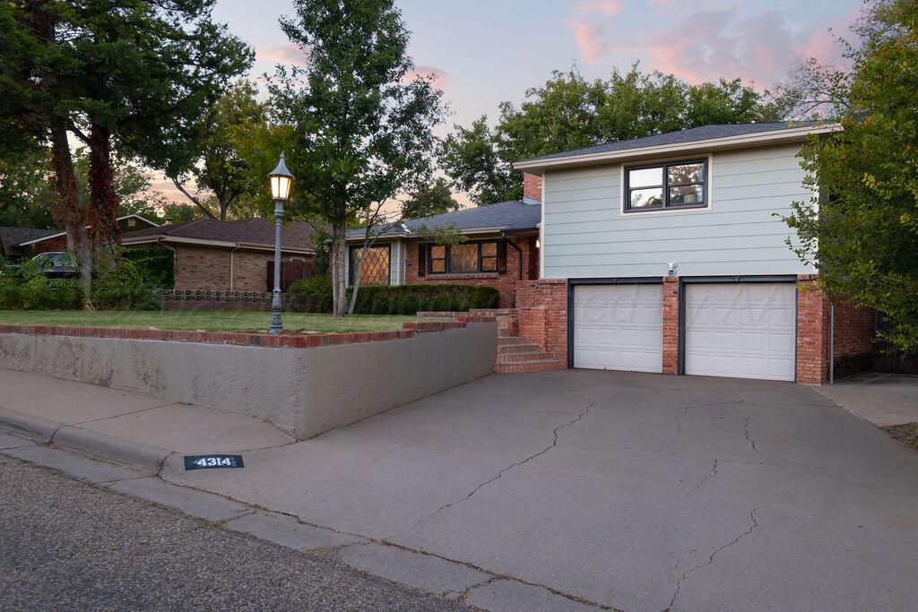 4314 Emil Avenue Amarillo, TX 79106 - Photo 3 of 44 front view of a house with a yard