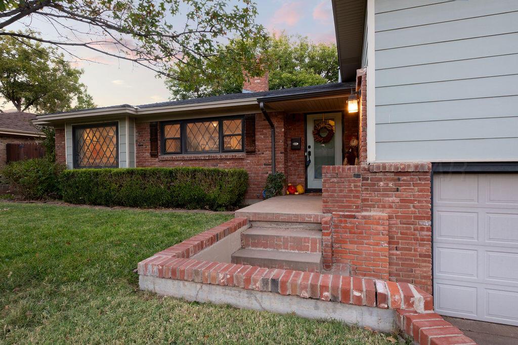 4314 Emil Avenue Amarillo, TX 79106 - Photo 4 of 44 a front view of a house with garden