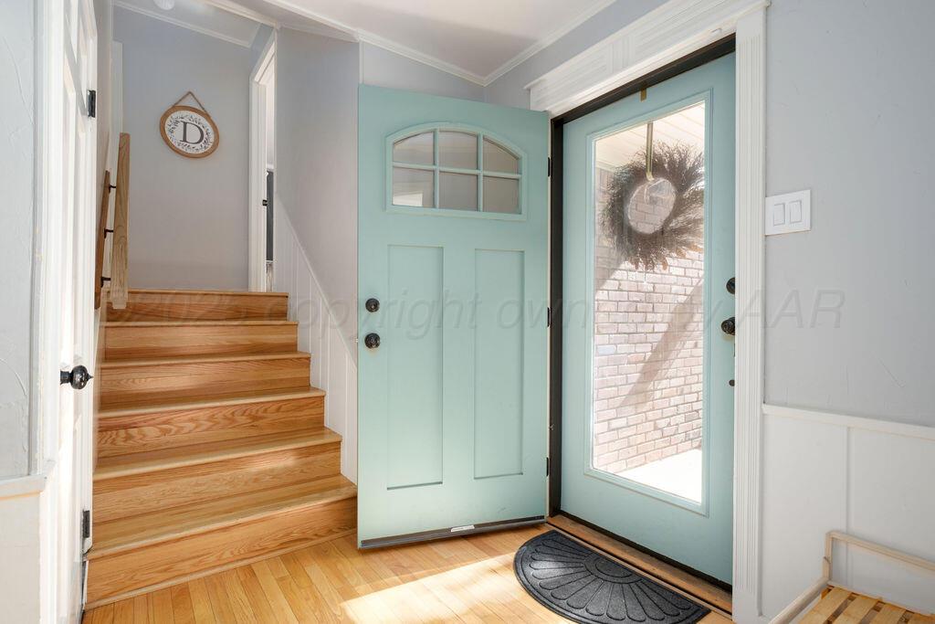4314 Emil Avenue Amarillo, TX 79106 - Photo 6 of 44 a view of an entryway with wooden floor and door