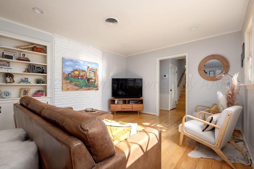 4314 Emil Avenue Amarillo, TX 79106 - Photo 8 of 44 a living room with furniture and a flat screen tv