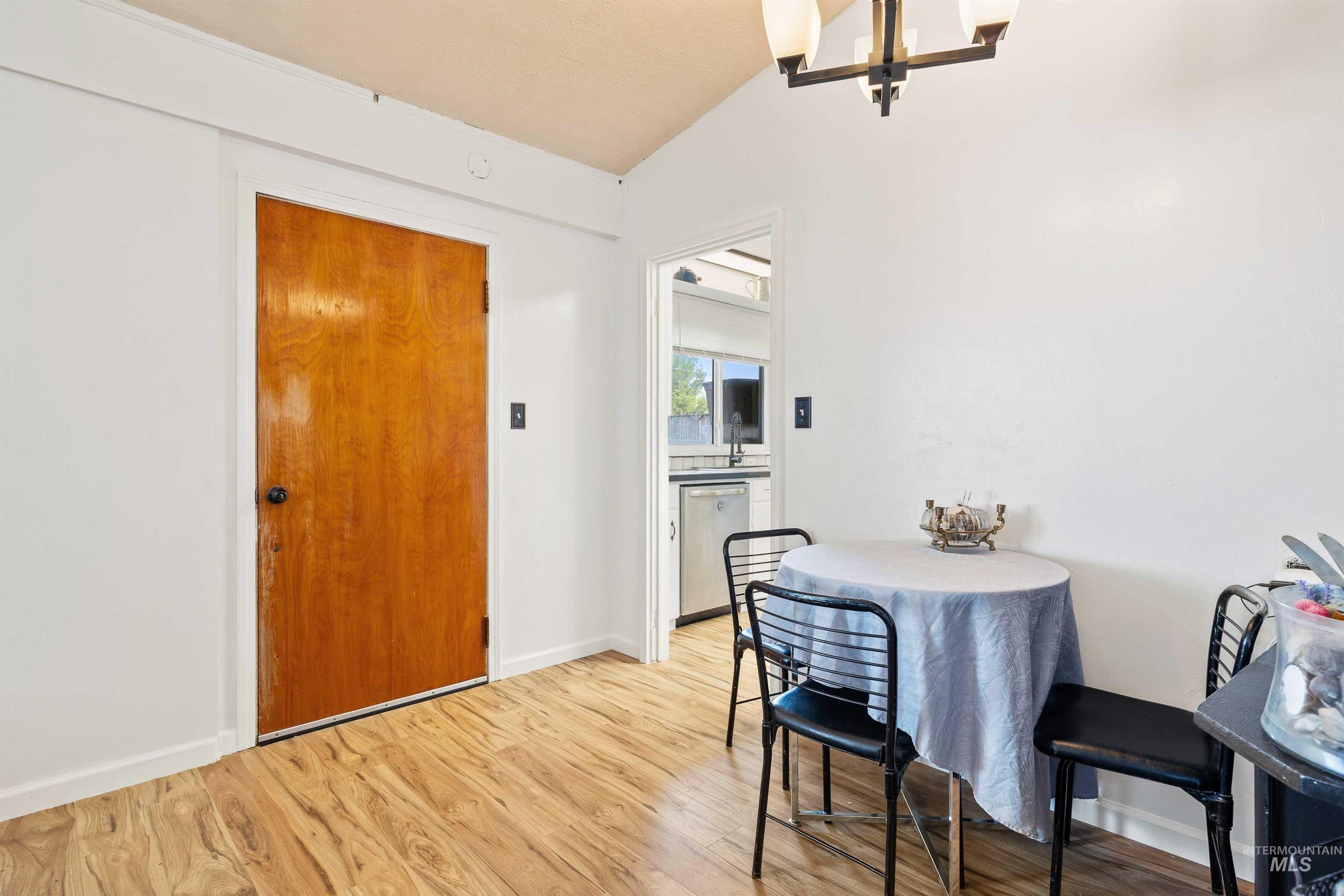 817 Union Avenue Filer, ID 83328 - Photo 8 of 37 Dining area with light wood-type flooring and a chandelier