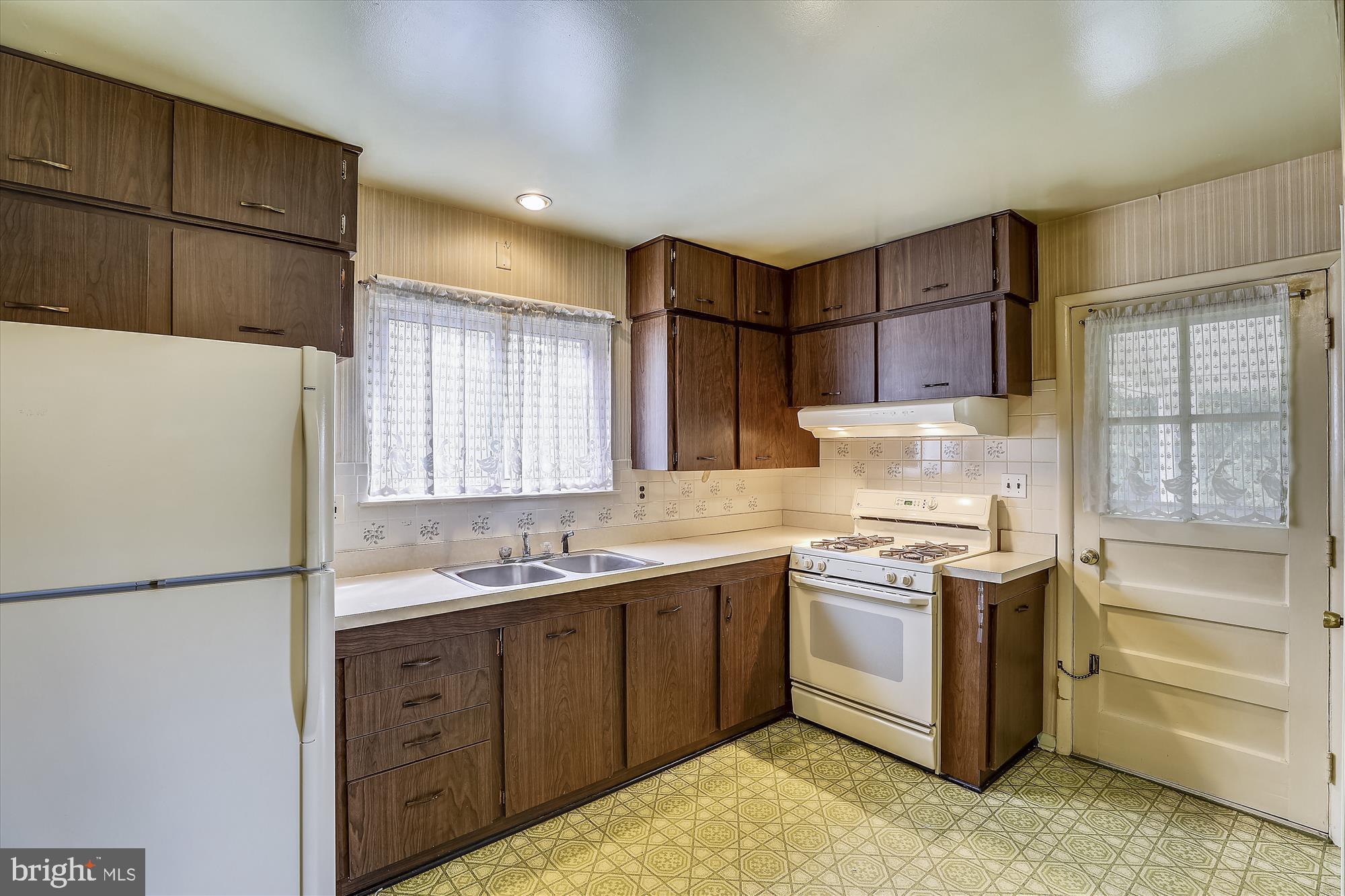 1412 Harberson Road Baltimore, MD 21228 - Photo 7 of 28 Tons of cabinets, pantry to the right of door