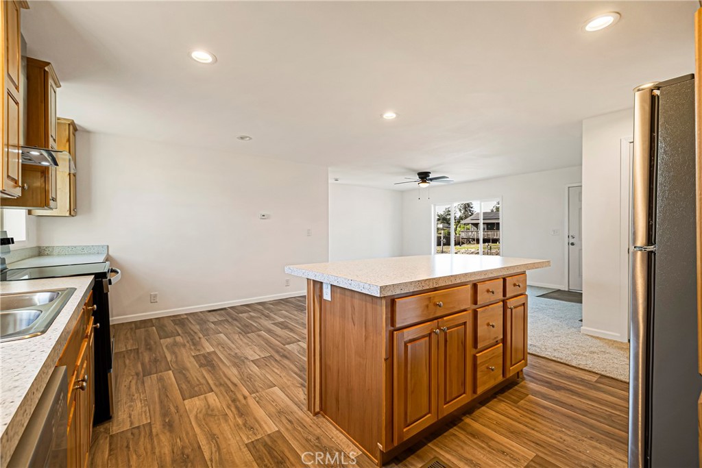 5352 Sawmill Road Paradise, CA 95969 - Photo 12 of 23 a kitchen with a sink and a refrigerator