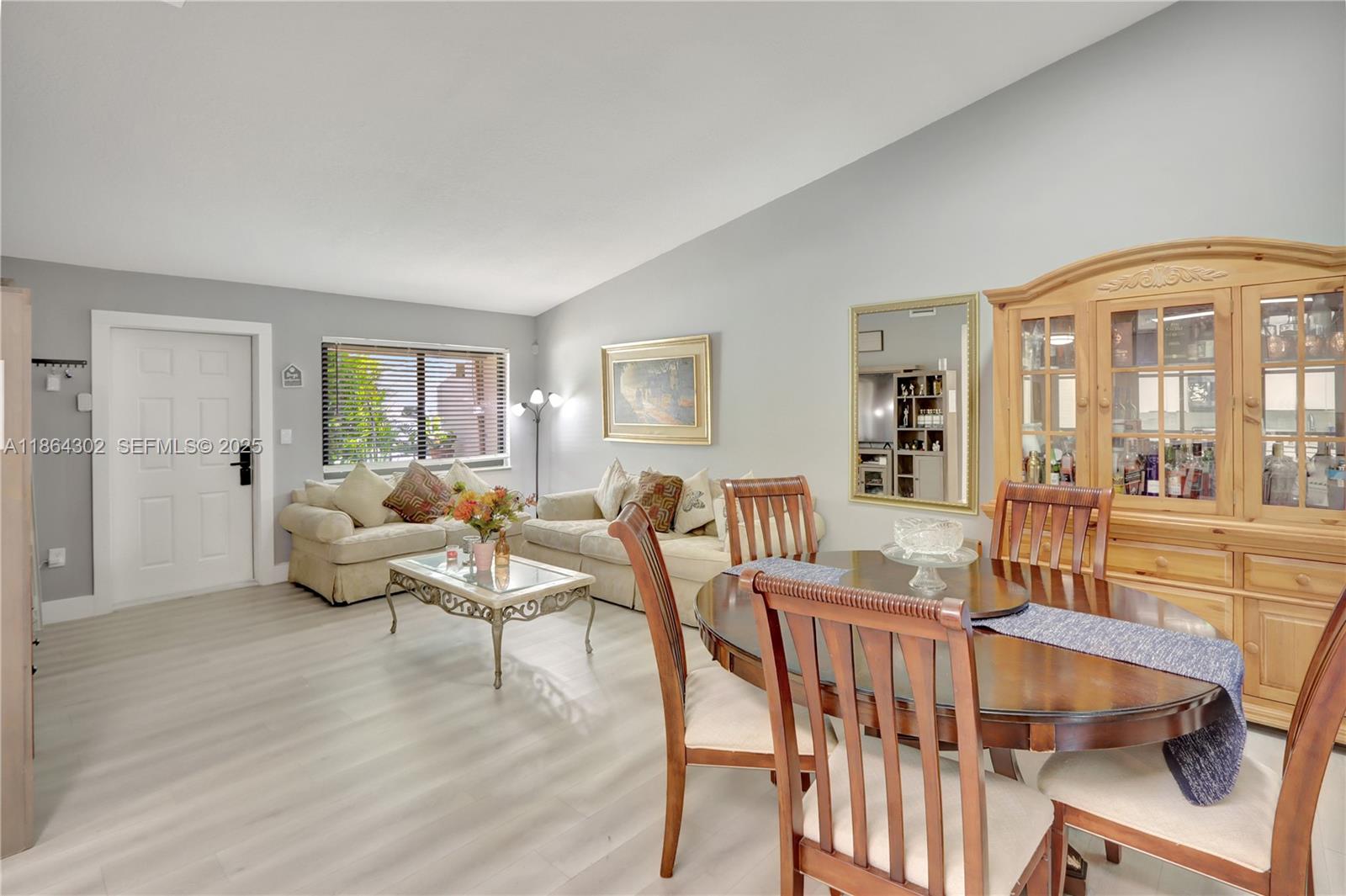 7680 Southwest 156th Court, Unit B113 Miami, FL 33193 - Photo 4 of 16 a living room with furniture and wooden floor