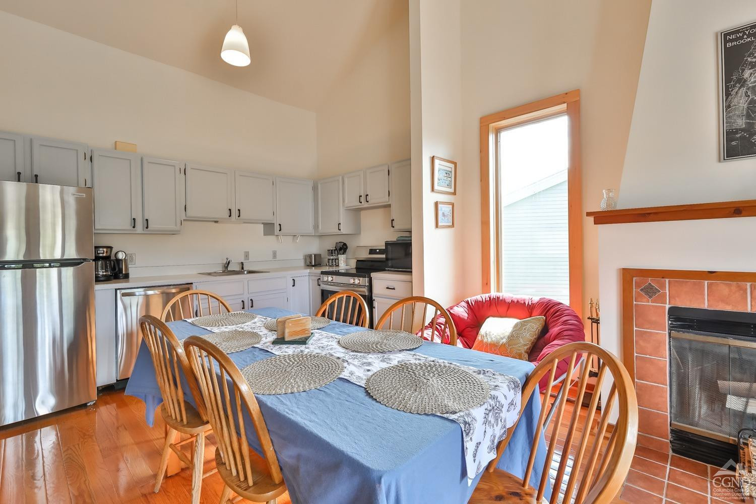 28-1 Loo Bridge Lane, Unit 22A Windham, NY 12496 - Photo 19 of 35 a living room with furniture fireplace and a window