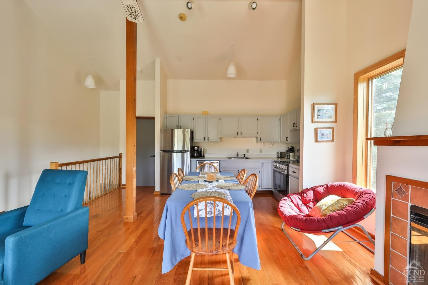 28-1 Loo Bridge Lane, Unit 22A Windham, NY 12496 - Photo 20 of 35 a living room with furniture and a view of kitchen