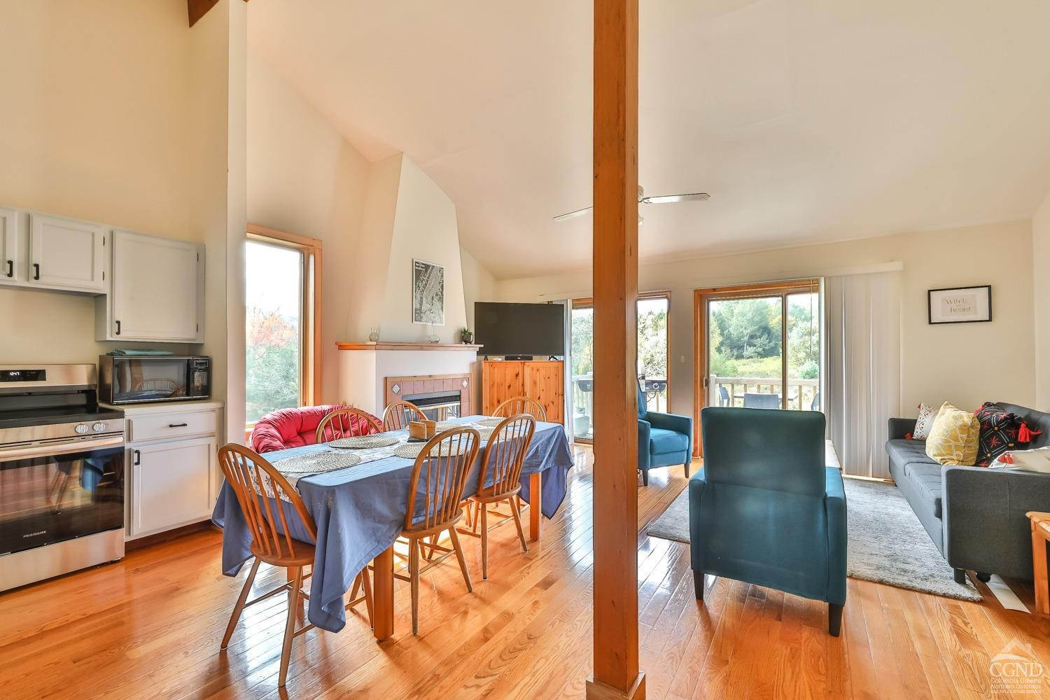 28-1 Loo Bridge Lane, Unit 22A Windham, NY 12496 - Photo 22 of 35 a kitchen with stainless steel appliances wooden floor dining table and chairs